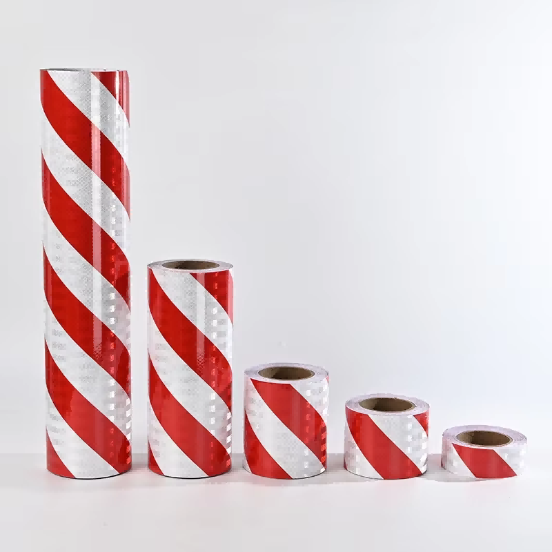 Five rolls of red and white reflective warning tape in different sizes