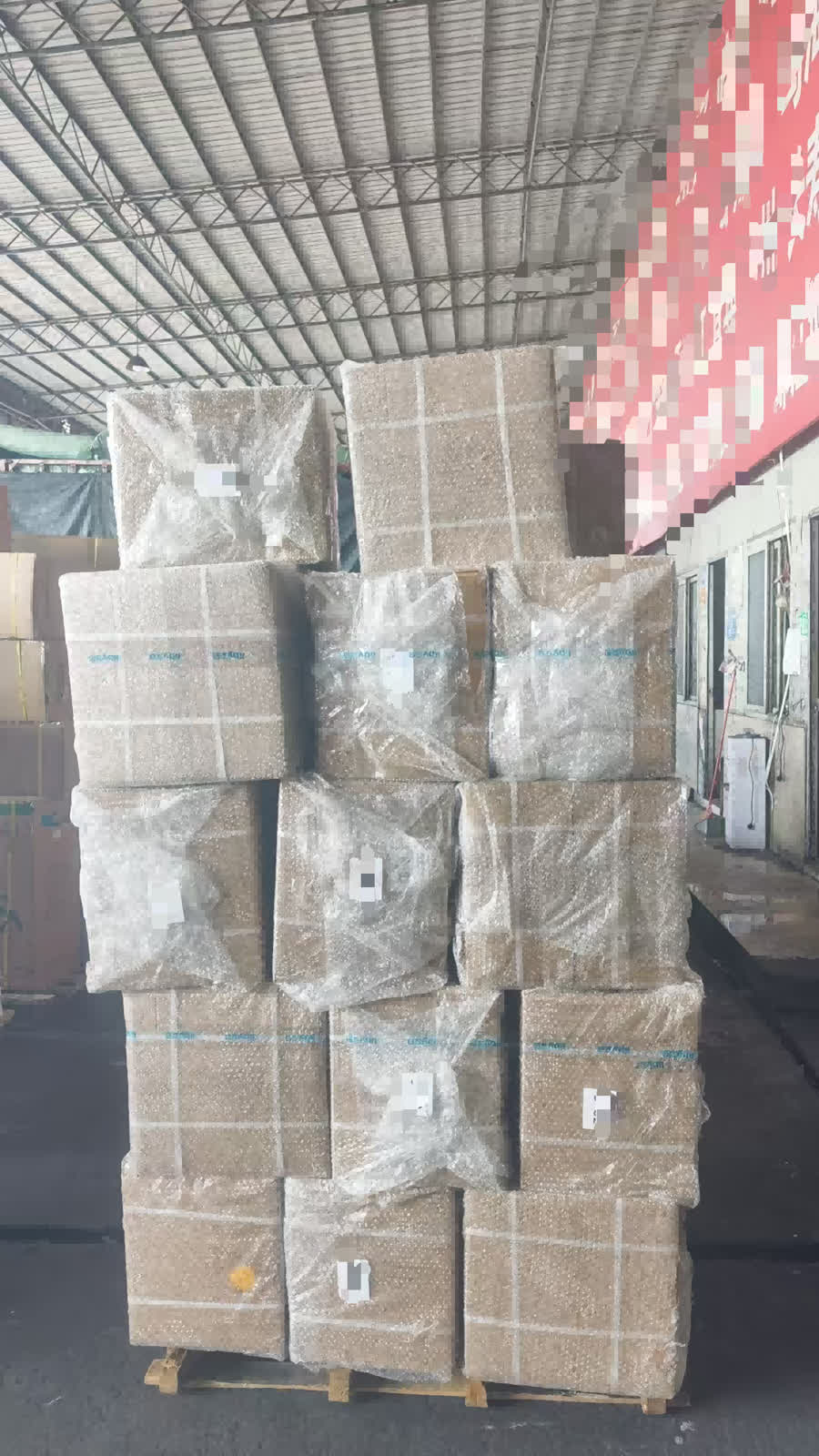 Pallet of finished reflective sheeting cartons wrapped and strapped for shipment