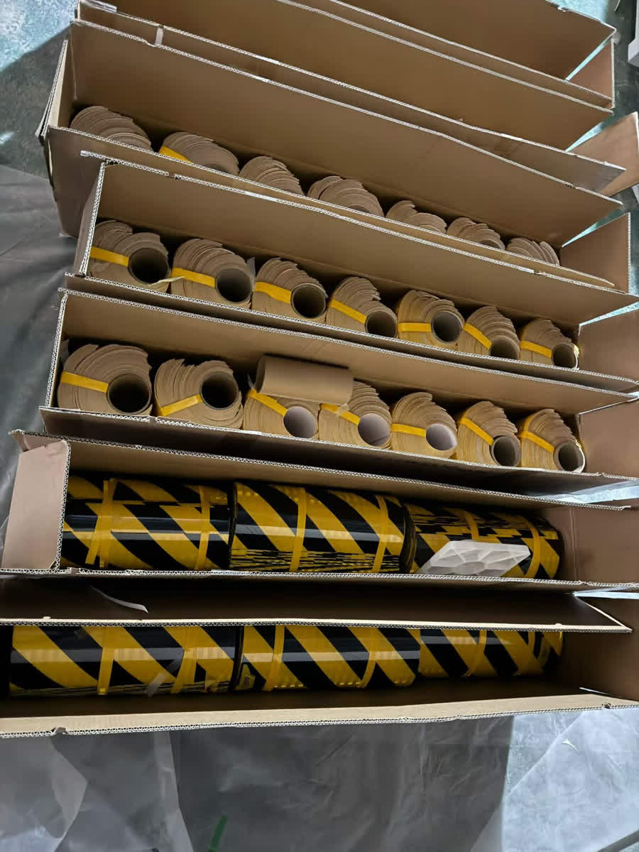 Stacked cartons of cut tape rolls and caution tape rolls ready for shipment